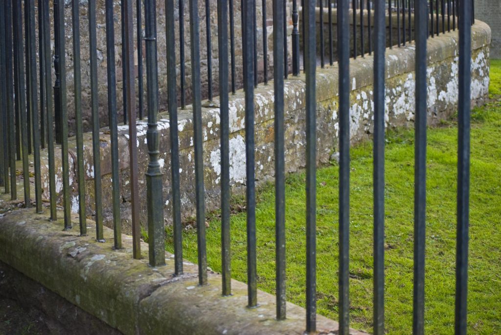 a metal bar fence